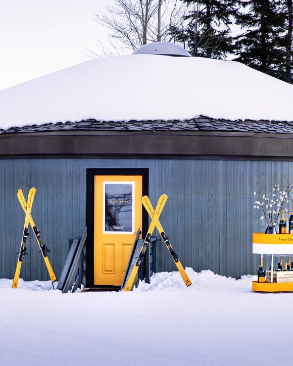 Veuve Clicquot Cabin in Aspen in the Snow with skis